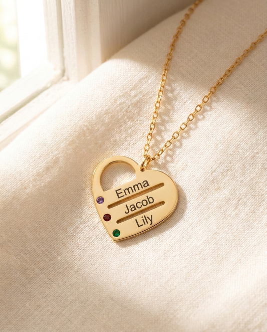Gold-tone family heart necklace with three names in plain upright letters and small birthstone-colour stones